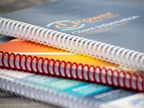 Custom spiral bound books with colored coil bindings